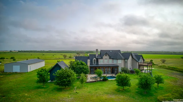 a kitchen with stainless steel appliances granite countertop a stove and a refrigerator