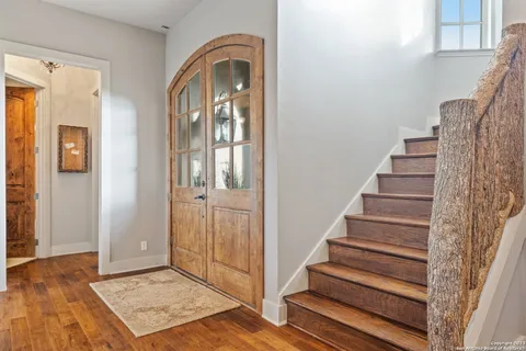 a view of a bathroom with a granite countertop sink and a window