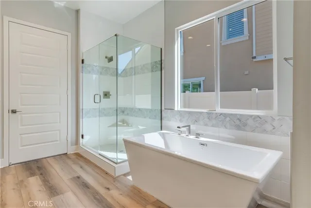 a bathroom with a bathtub and a sink