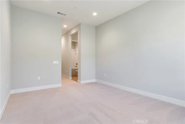 a bathroom with a granite countertop sink toilet a large mirror a bathtub and shower