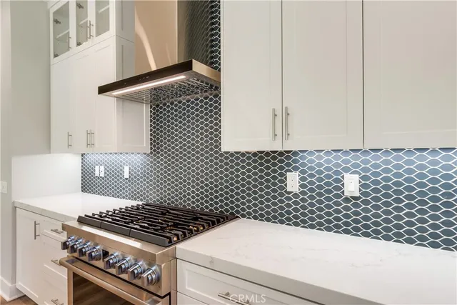 a close view of a stove a sink and dishwasher