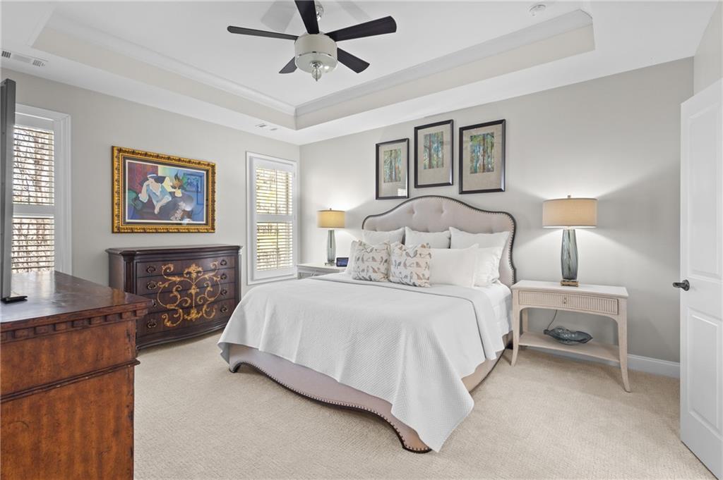 4469 Tacoma Trace Suwanee, GA 30024 - Photo 12 of 62 a bedroom with a large bed and a window