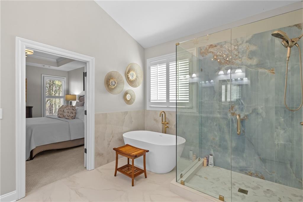 4469 Tacoma Trace Suwanee, GA 30024 - Photo 16 of 62 a bathroom with a sink toilet a mirror and shower