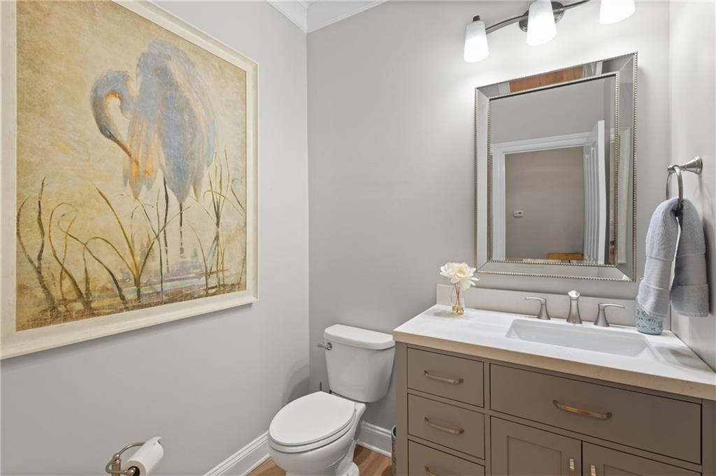 4469 Tacoma Trace Suwanee, GA 30024 - Photo 18 of 62 a bathroom with a granite countertop sink mirror vanity and toilet