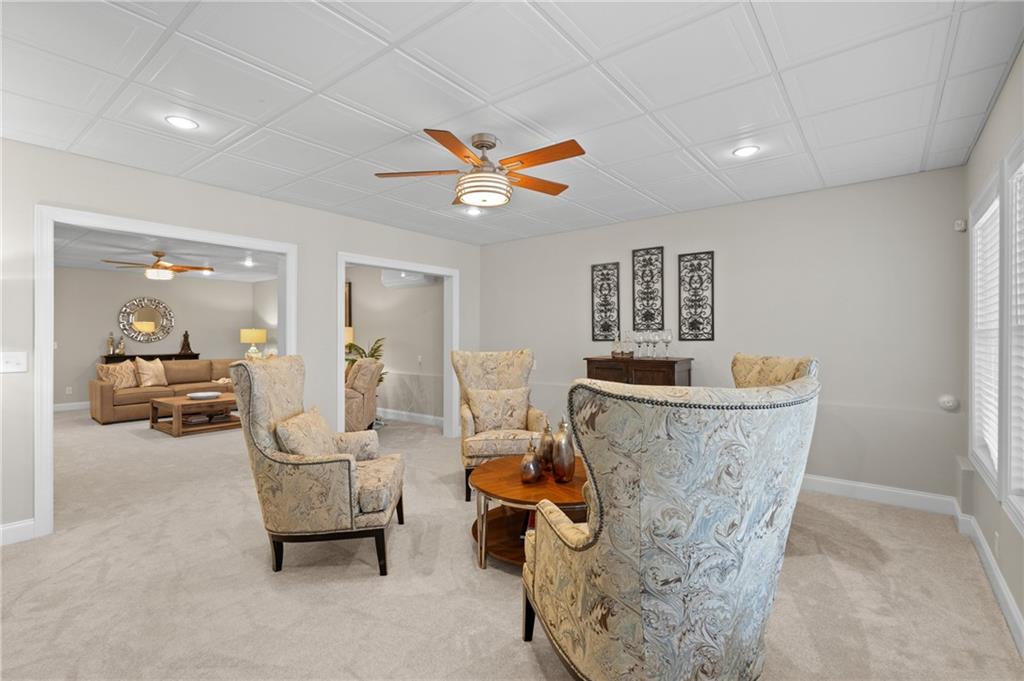 4469 Tacoma Trace Suwanee, GA 30024 - Photo 34 of 62 a living room with furniture and a large window