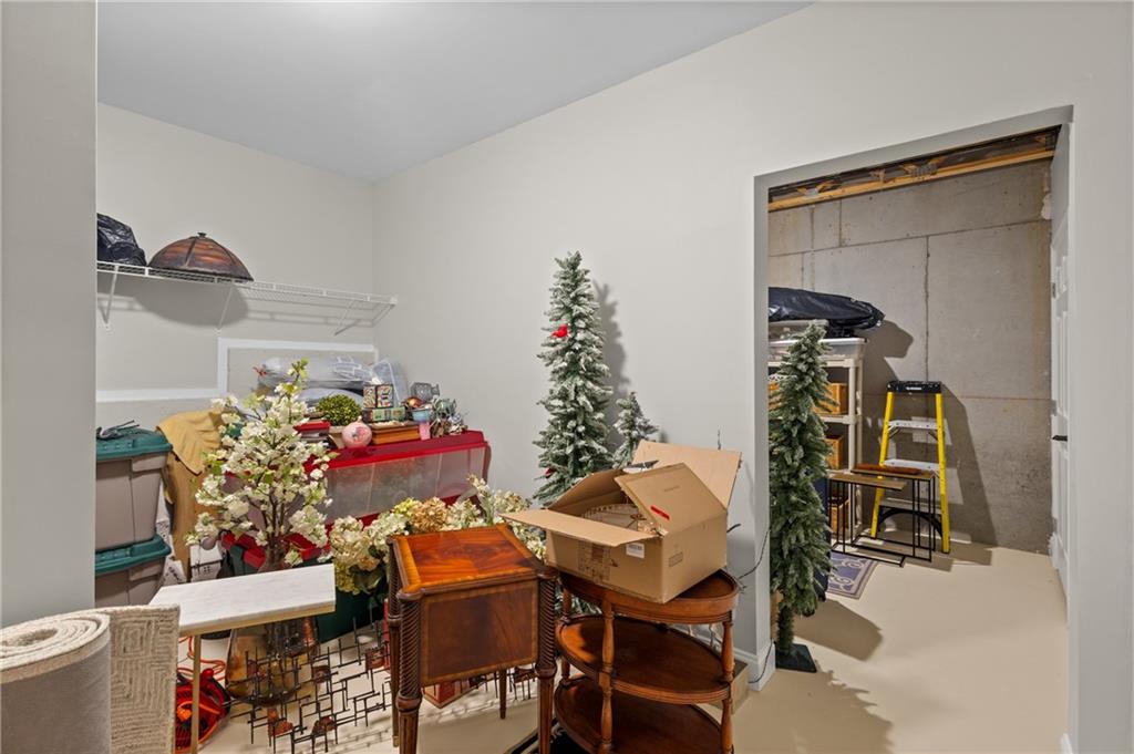 4469 Tacoma Trace Suwanee, GA 30024 - Photo 38 of 62 a view of a dining room with furniture and wooden floor