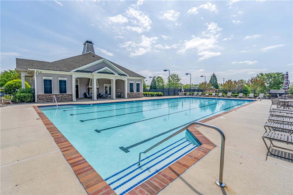 4469 Tacoma Trace Suwanee, GA 30024 - Photo 54 of 62 a view of a house with pool and a yard