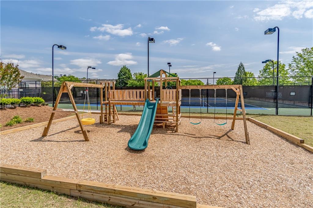 4469 Tacoma Trace Suwanee, GA 30024 - Photo 56 of 62 a view of a park with swings