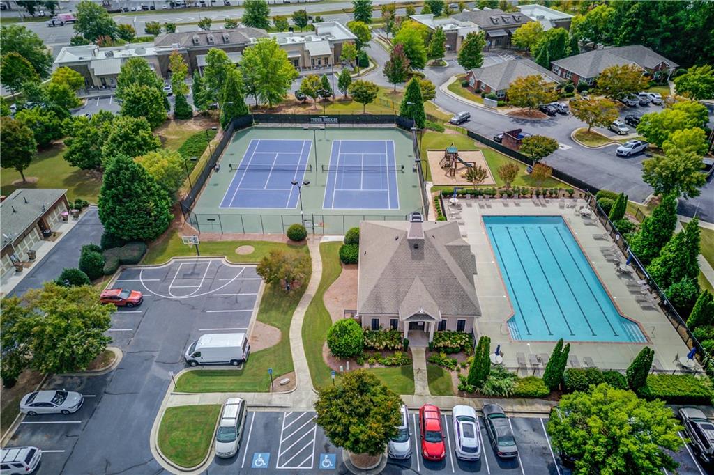 4469 Tacoma Trace Suwanee, GA 30024 - Photo 58 of 62 an aerial view of a house with a swimming pool outdoor seating and yard