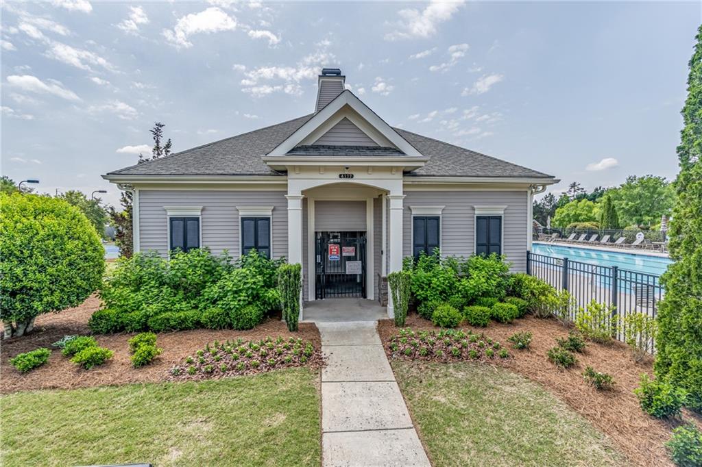 4469 Tacoma Trace Suwanee, GA 30024 - Photo 59 of 62 a view of house and garden with large trees