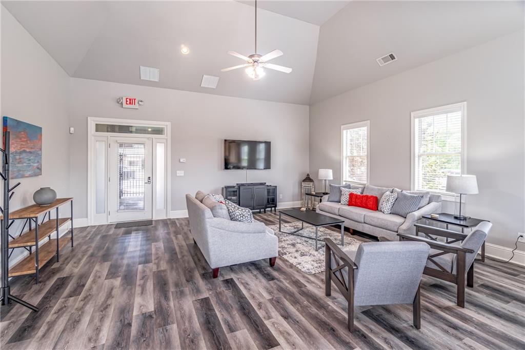 4469 Tacoma Trace Suwanee, GA 30024 - Photo 61 of 62 a living room with furniture and wooden floor