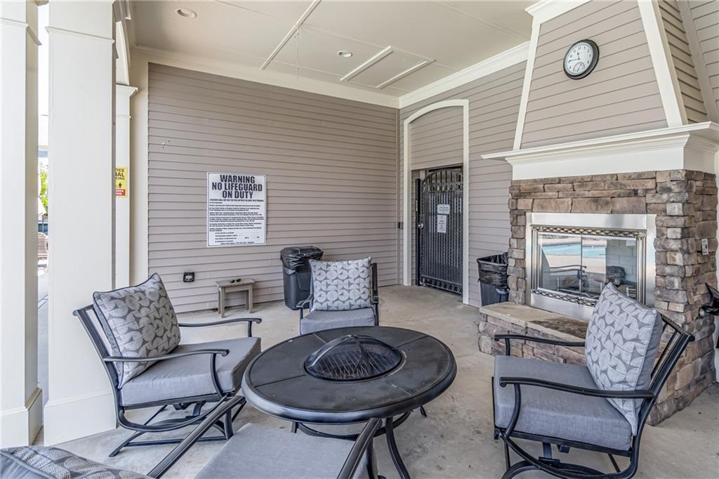 4469 Tacoma Trace Suwanee, GA 30024 - Photo 62 of 62 a living room with furniture and a wooden floor