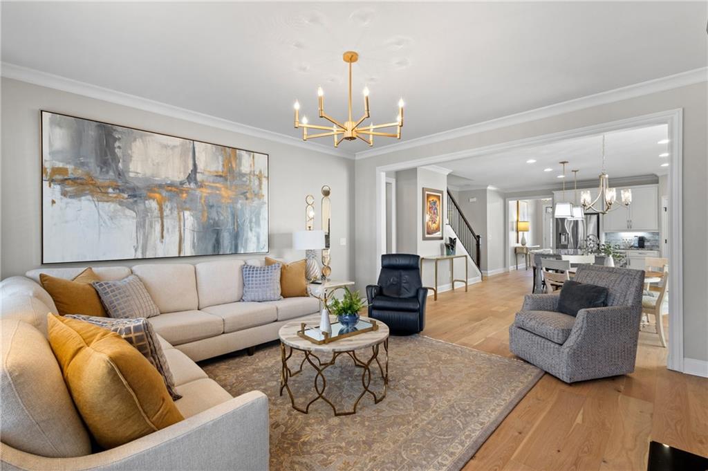 4469 Tacoma Trace Suwanee, GA 30024 - Photo 8 of 62 a living room with fireplace furniture and a large window