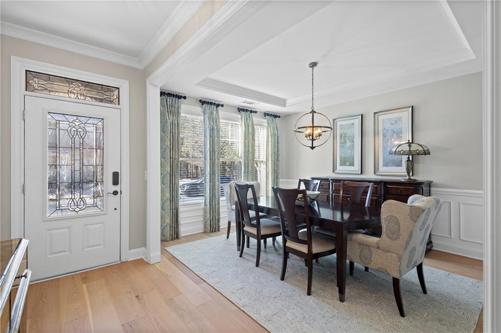 4469 Tacoma Trace Suwanee, GA 30024 - Photo 10 of 62 a dining room with furniture window wooden floor