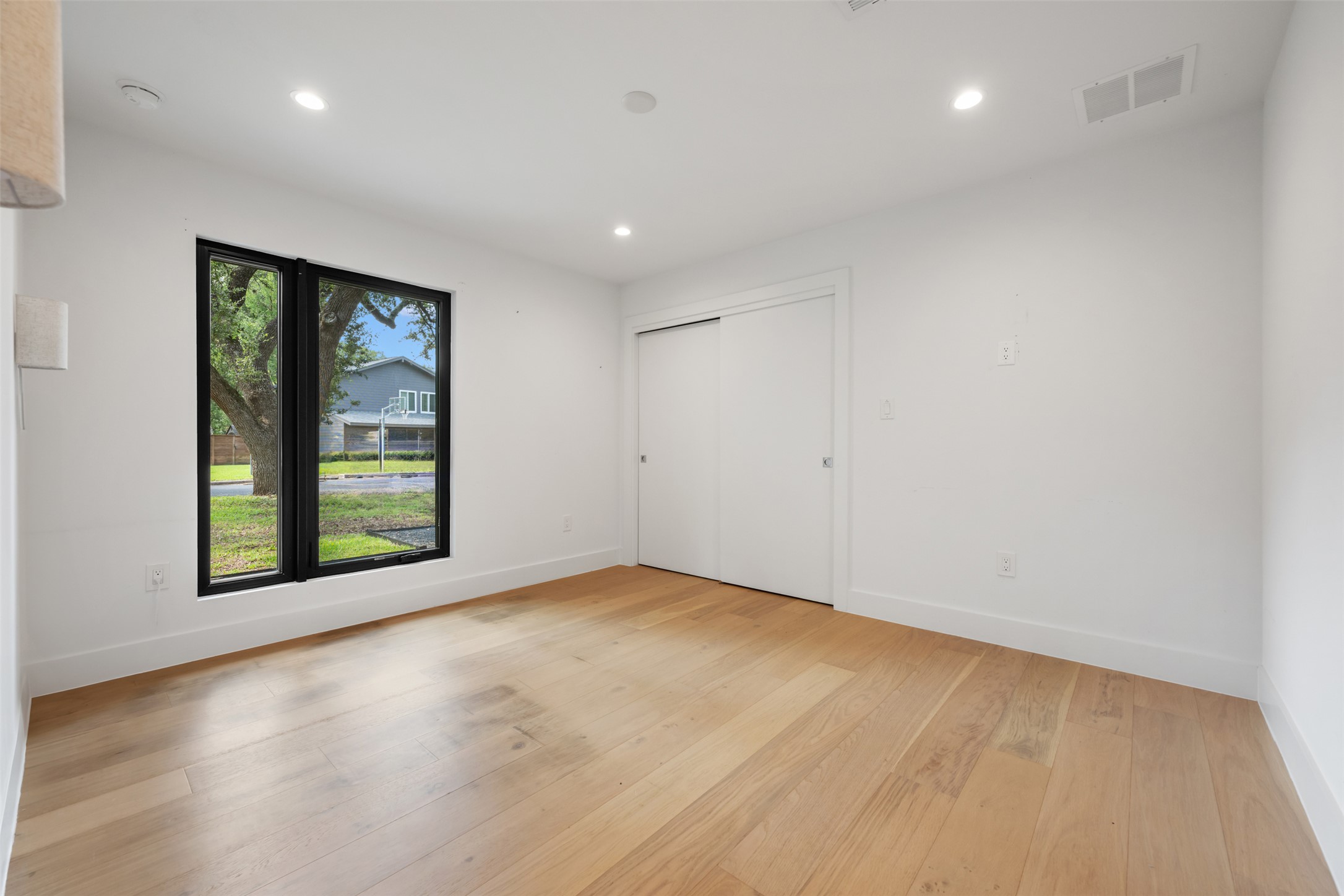 8900 Point W Drive Austin, TX 78759 - Photo 31 of 40 Warm wood floors and recessed lighting enhance this airy space, ready for your personal touch.