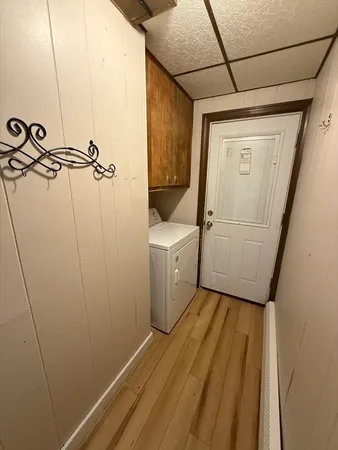 a view of a storage & utility room with a washer dryer