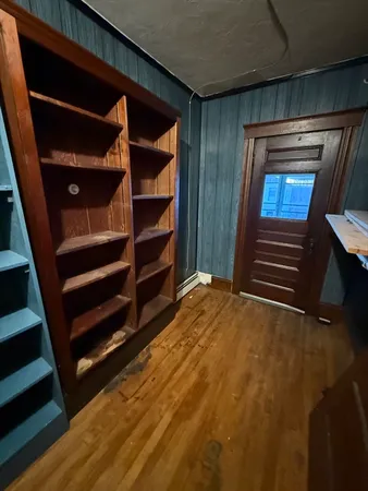 a view of walk in closet with empty racks