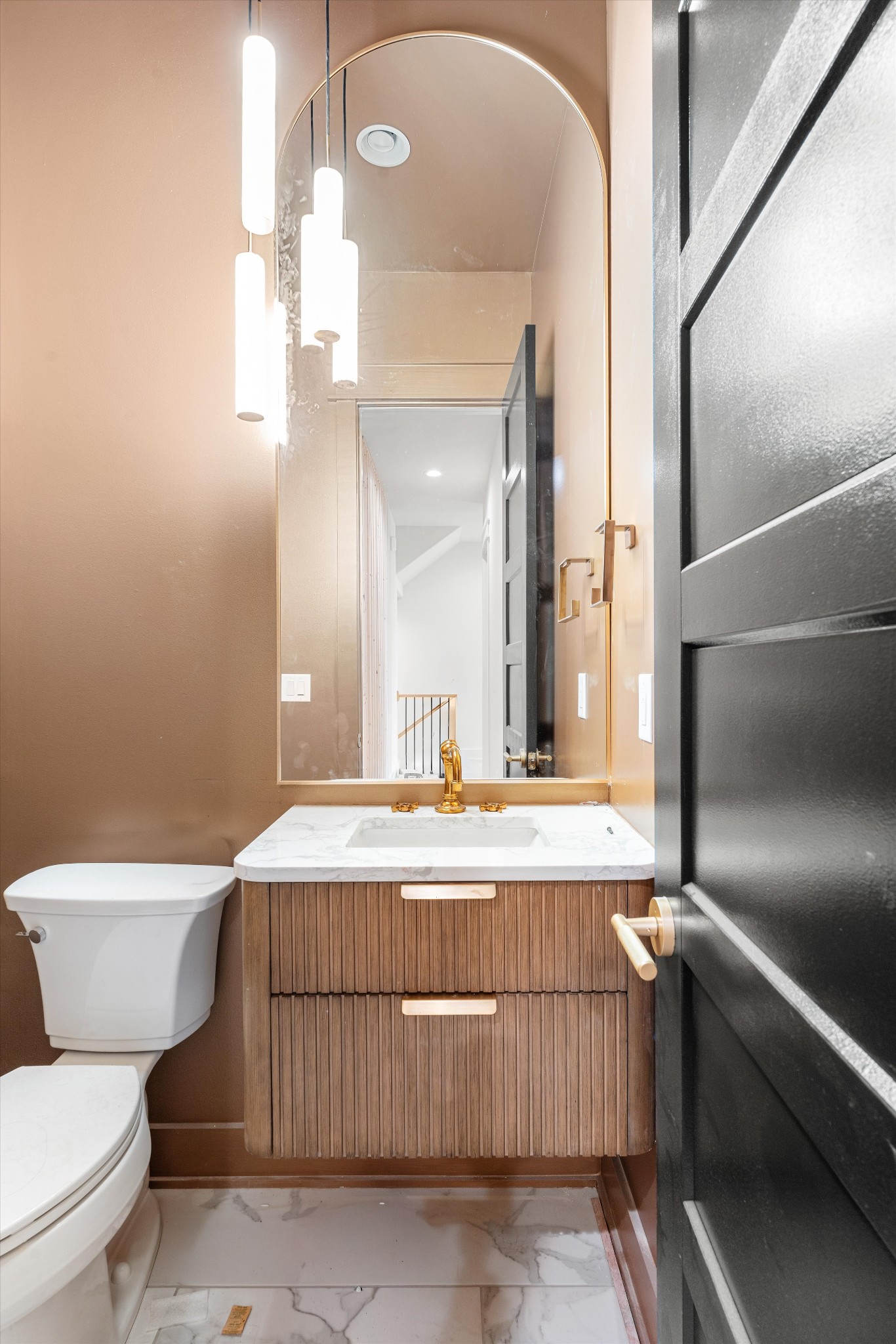 1007 Sevier Street Nashville, TN 37206 - Photo 22 of 55 a bathroom with a toilet a sink and mirror