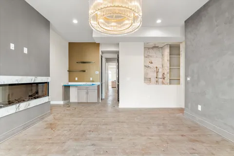 a spacious bathroom with a granite countertop sink and a mirror