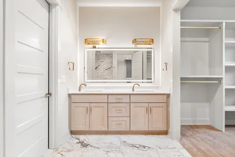 a bathroom with a bathtub and shower