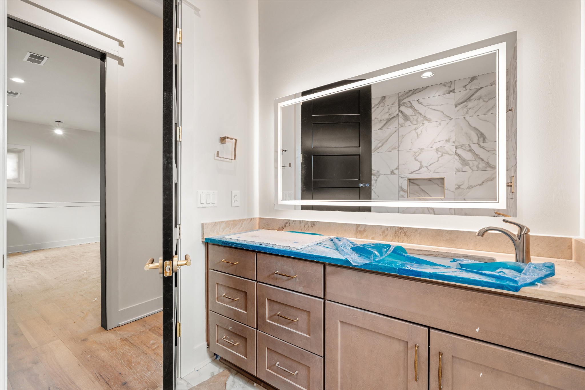 1007 Sevier Street Nashville, TN 37206 - Photo 36 of 55 a bathroom with a sink and a large mirror