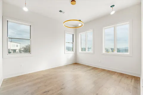 a view of an empty room with a window