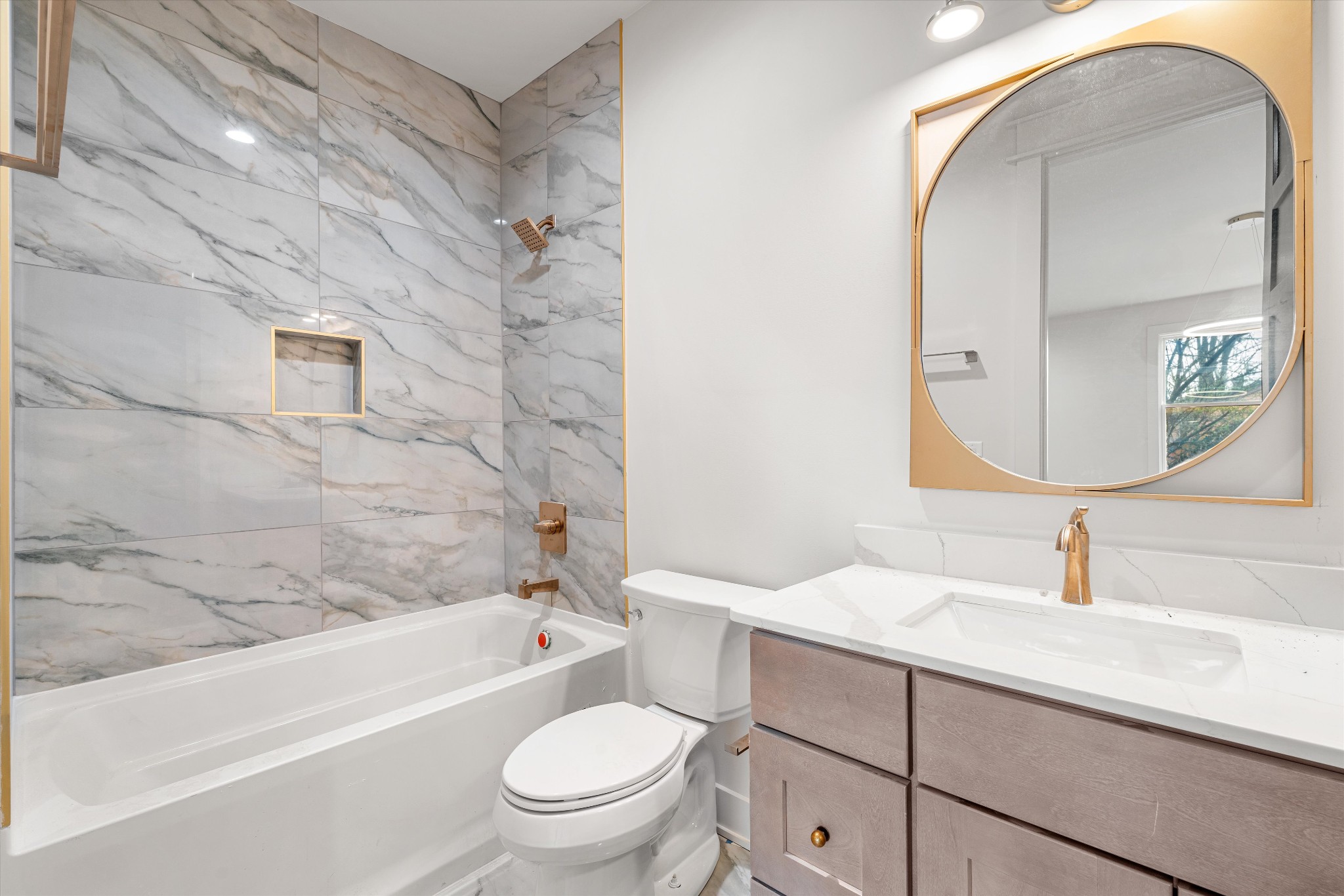 1007 Sevier Street Nashville, TN 37206 - Photo 8 of 55 a bathroom with a sink a toilet and a mirror