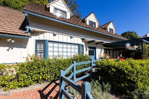 a front view of house and yard with seating space
