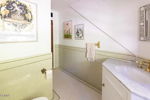 a bedroom with bed and wooden floor