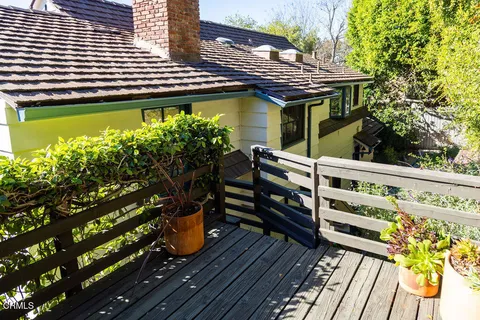 a bathroom with a toilet a sink and a mirror