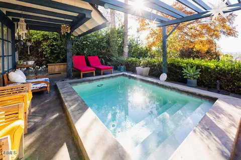 a view of swimming pool with lounge chair