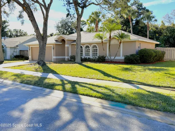 a view of a house with swimming pool and a yard
