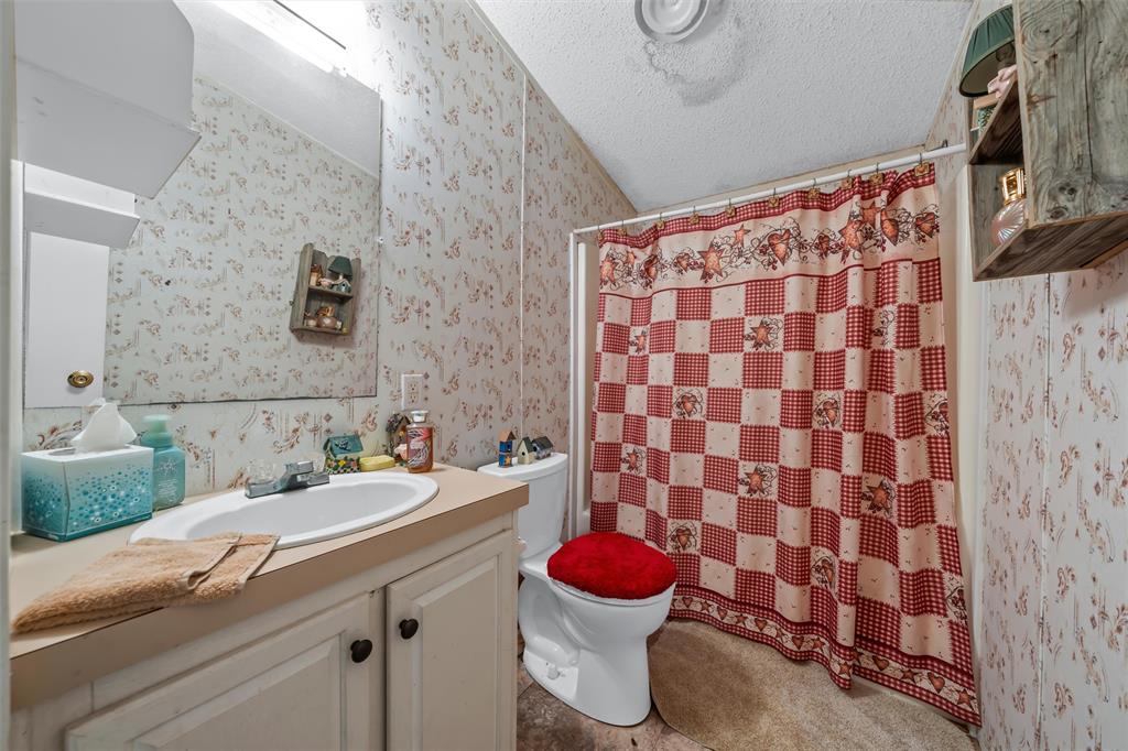236 Bode Road Elm Mott, TX 76640 - Photo 16 of 33 a bathroom with a sink and a mirror