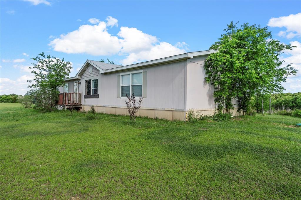 236 Bode Road Elm Mott, TX 76640 - Photo 22 of 33 a front view of house with yard and trees