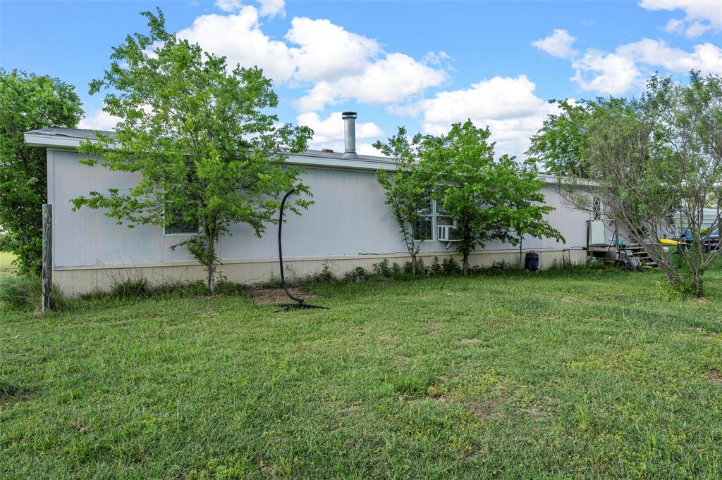 236 Bode Road Elm Mott, TX 76640 - Photo 24 of 33 a view of a backyard with plants and a garden