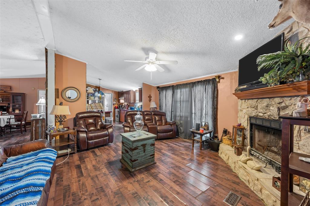 236 Bode Road Elm Mott, TX 76640 - Photo 7 of 33 a living room with furniture and a fireplace