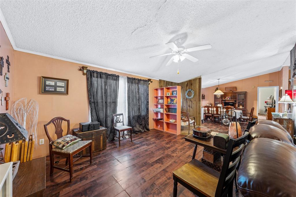 236 Bode Road Elm Mott, TX 76640 - Photo 8 of 33 a living room with furniture a ceiling fan and a rug