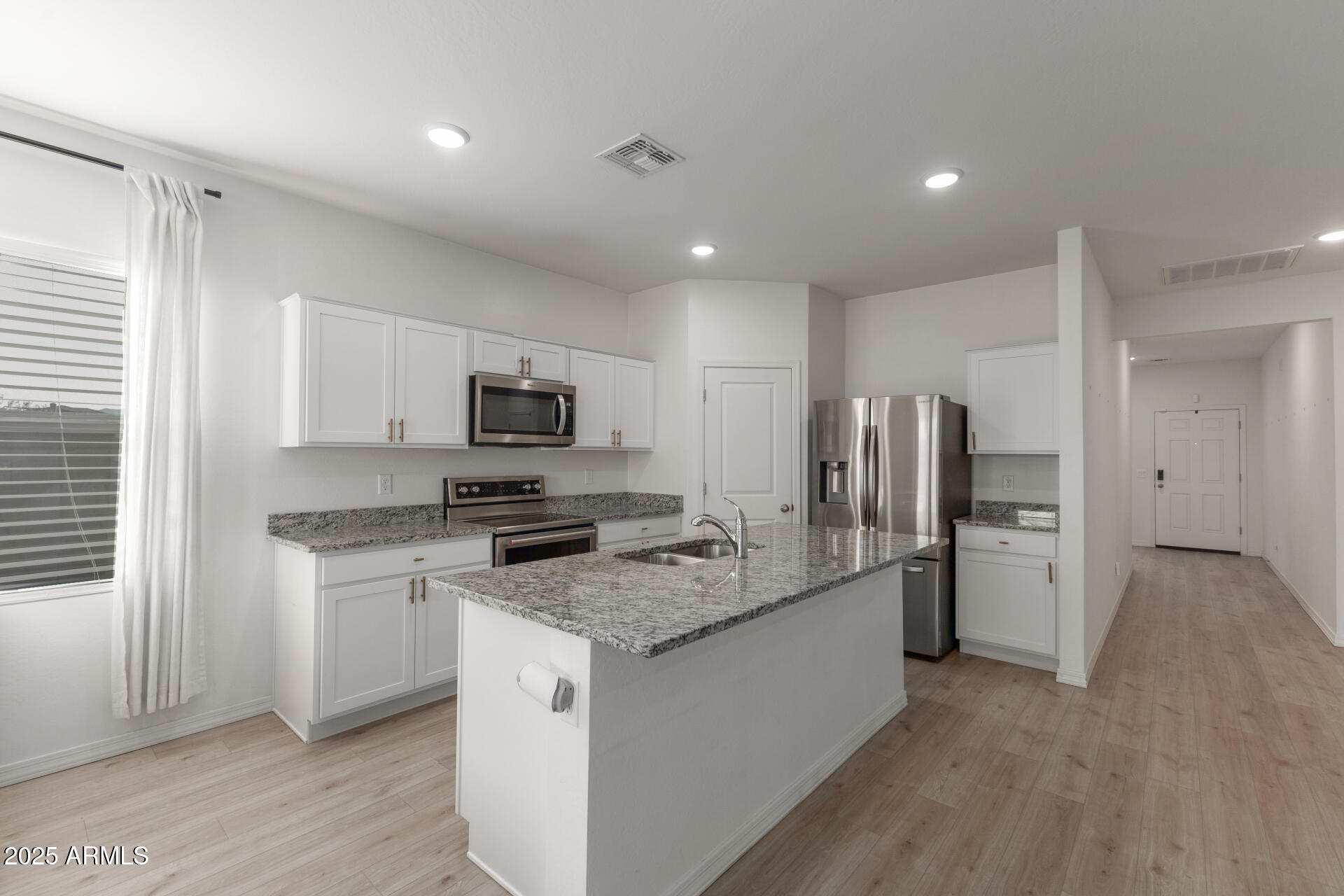 8133 South 64th Lane Laveen, AZ 85339 - Photo 5 of 32 a kitchen with a sink stove and refrigerator