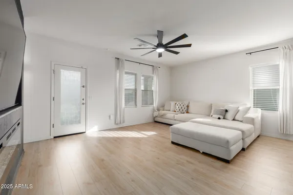 a spacious bedroom with a bed and a window
