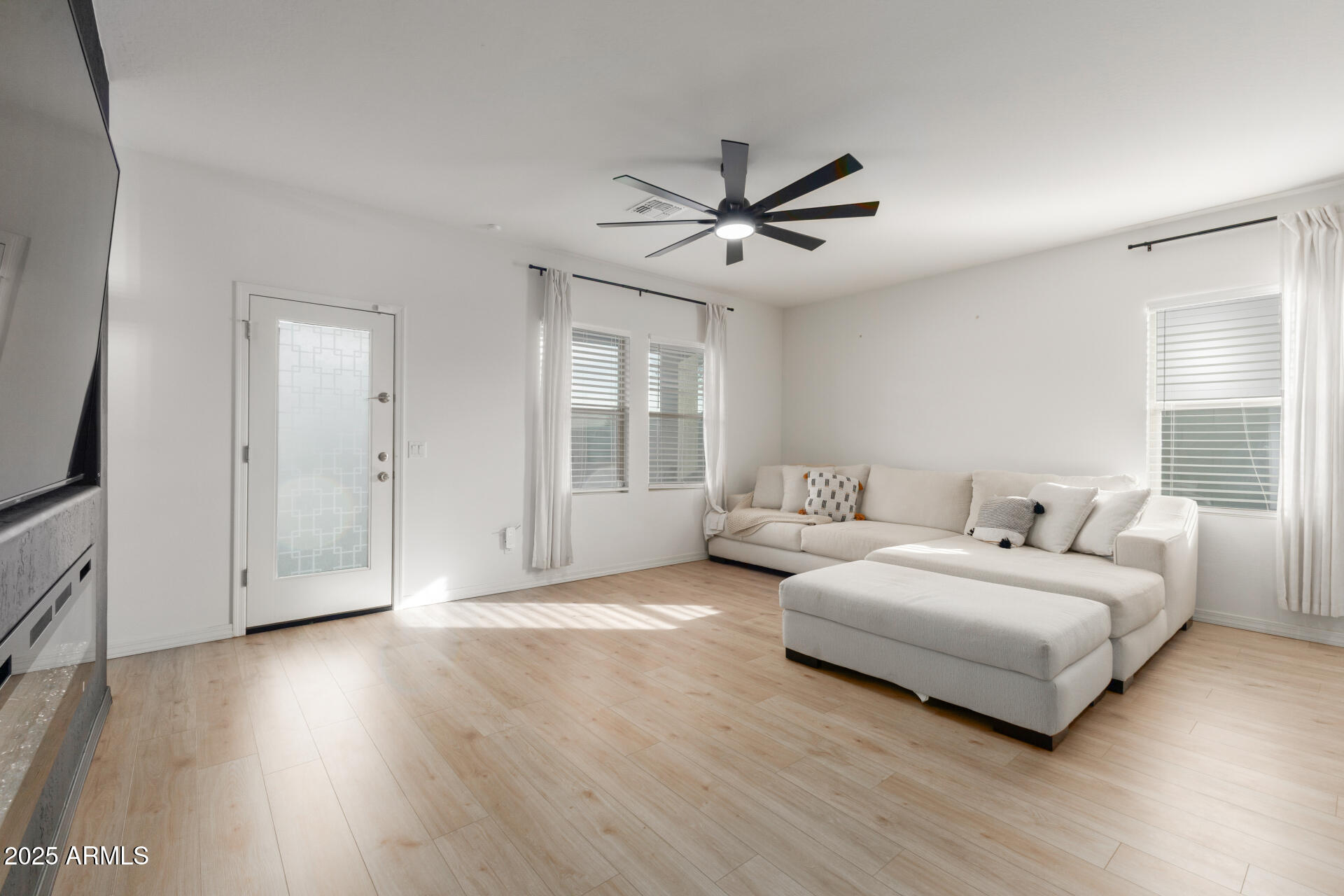 8133 South 64th Lane Laveen, AZ 85339 - Photo 9 of 32 a spacious bedroom with a bed and a window