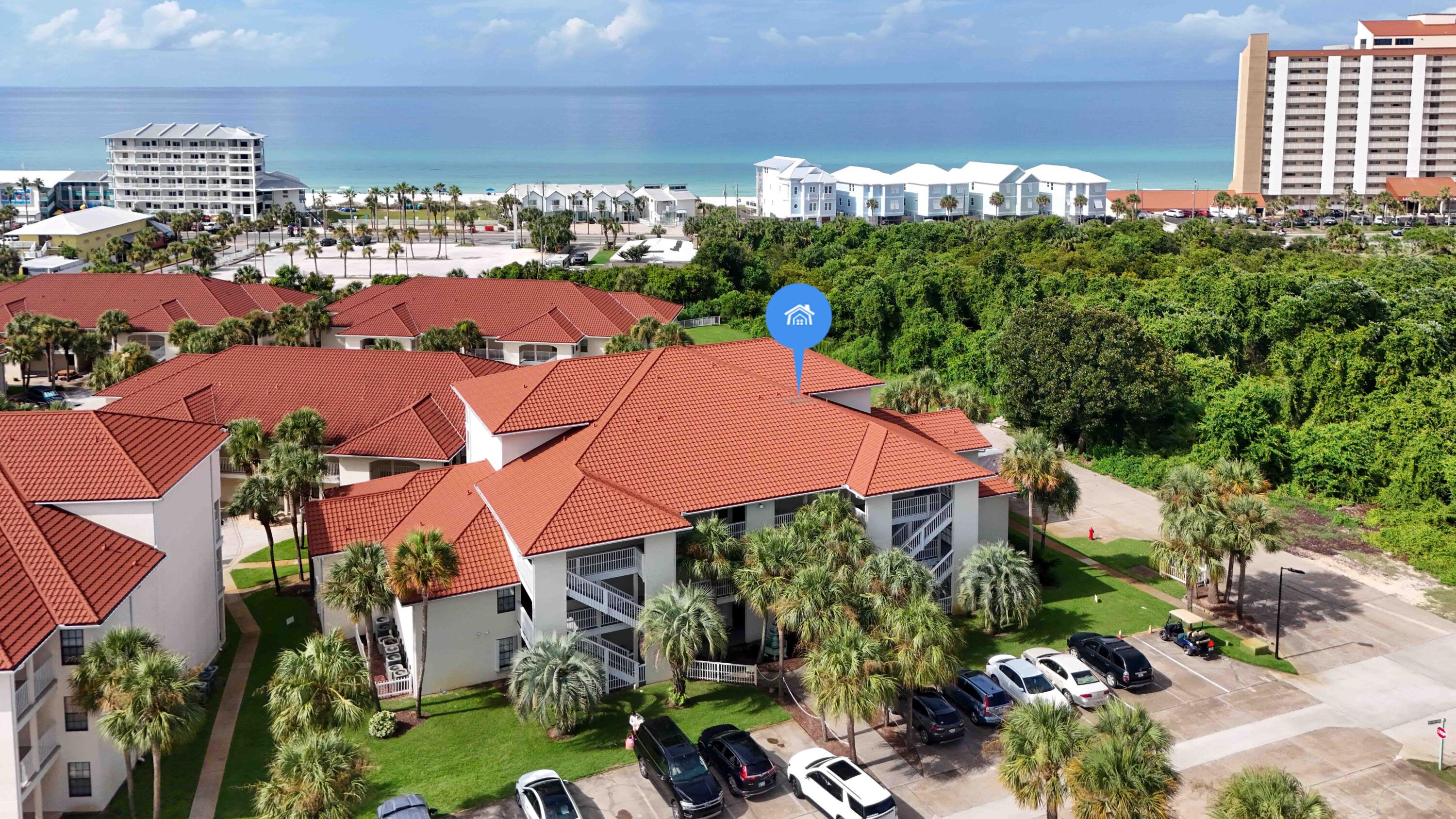 an aerial view of multiple houses with yard