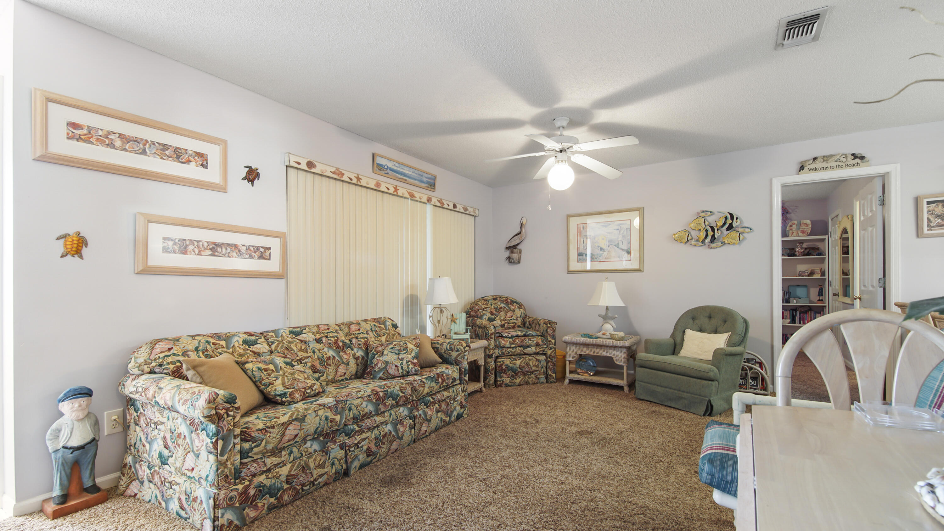 17462 Front Beach Road, Unit 54106 Panama City Beach, FL 32413 - Photo 16 of 32 a living room with furniture and a couch