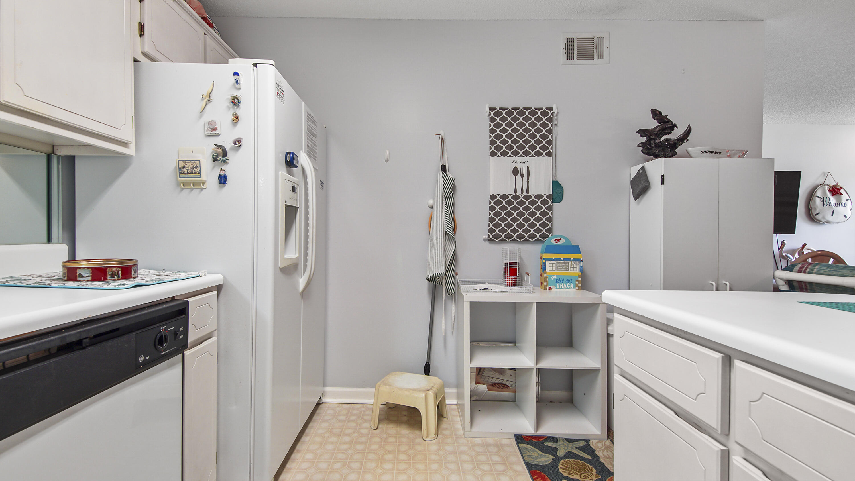 17462 Front Beach Road, Unit 54106 Panama City Beach, FL 32413 - Photo 21 of 32 a room that has a bed and a table in it