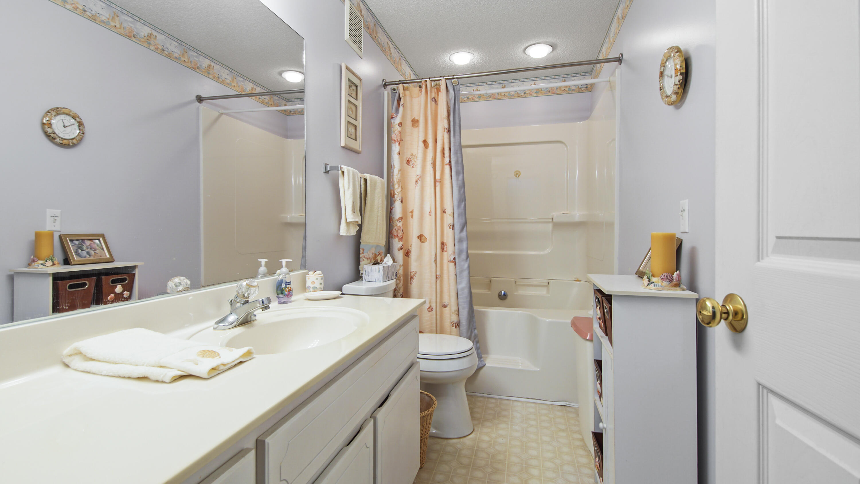 17462 Front Beach Road, Unit 54106 Panama City Beach, FL 32413 - Photo 26 of 32 a bathroom with a sink toilet and shower