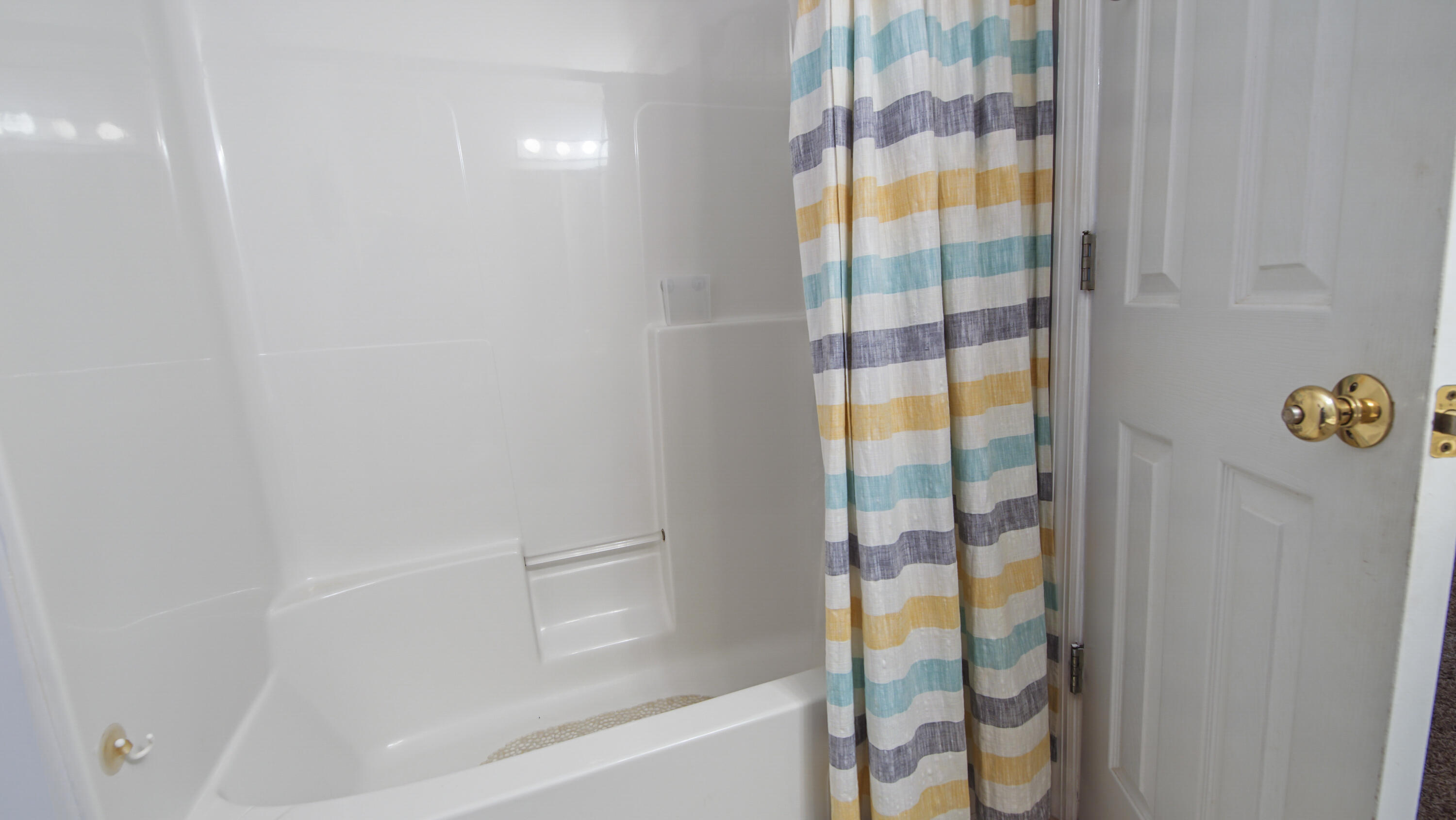 17462 Front Beach Road, Unit 54106 Panama City Beach, FL 32413 - Photo 32 of 32 a bathroom with a bathtub and shower