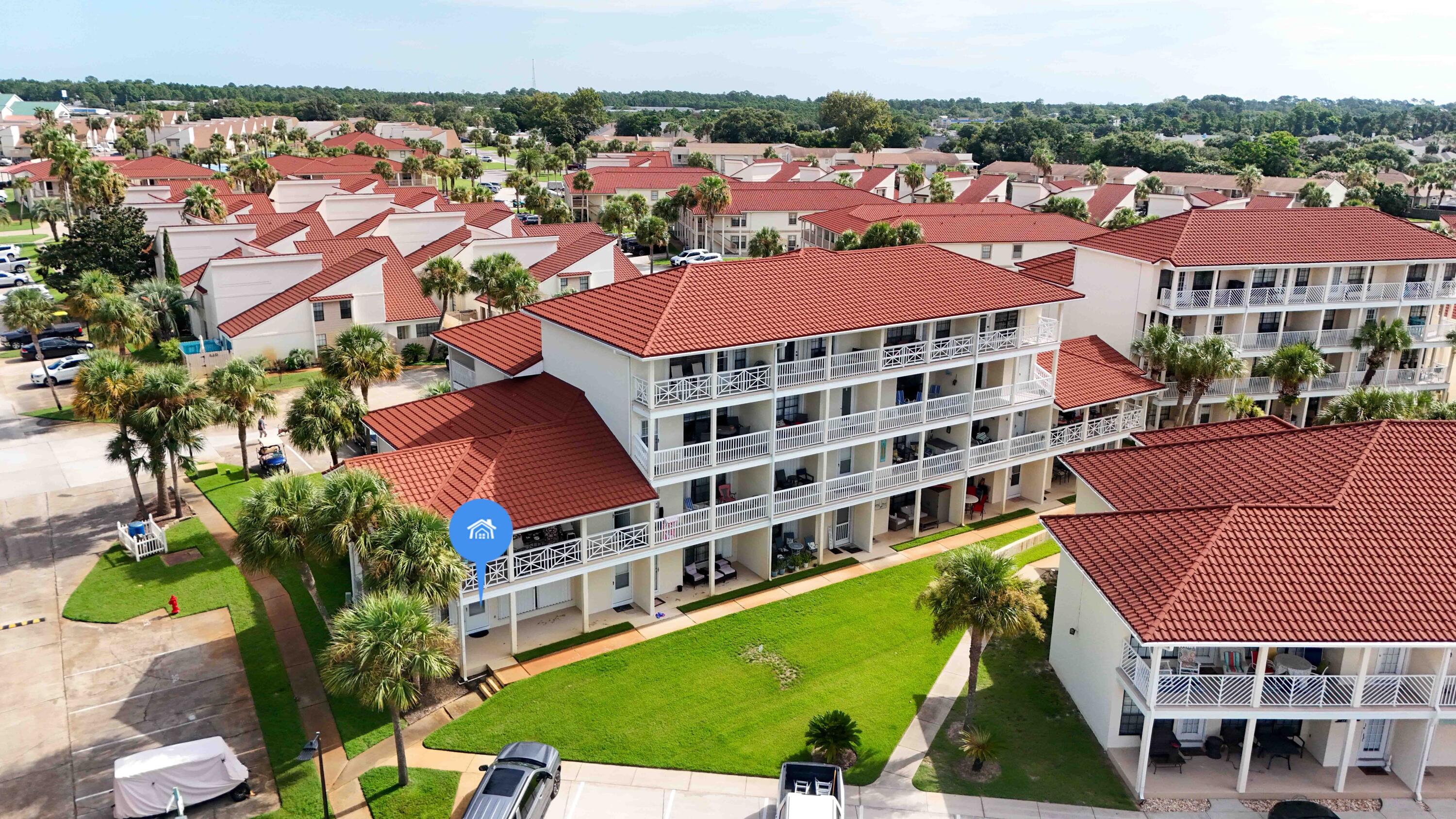 17462 Front Beach Road, Unit 54106 Panama City Beach, FL 32413 - Photo 6 of 32 an aerial view of residential houses with yard and ocean view