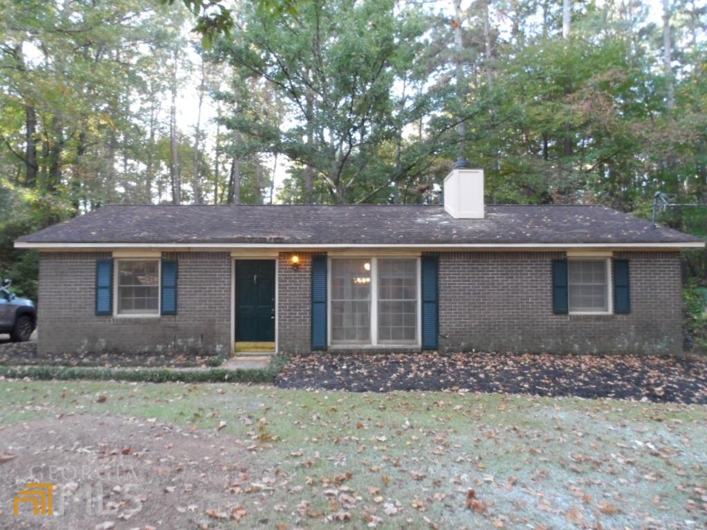 1188 Country Club Road Newnan, GA 30263 - Photo 1 of 1 a front view of a house with garden