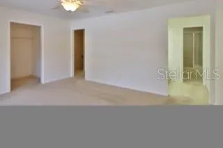 an empty room with a bathroom