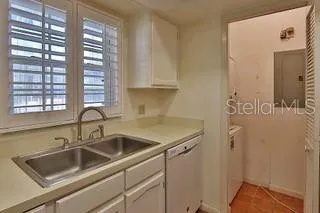 a kitchen with a sink and a window