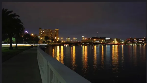 a view of deck with hardwood and lake view